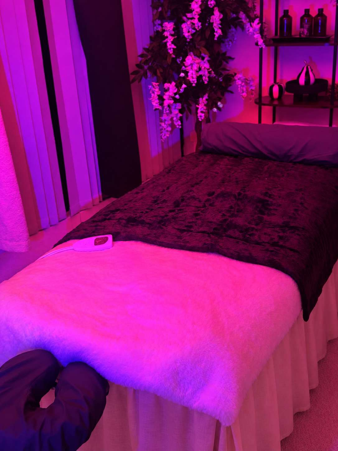 The prepared treatment table with a blanket and bolster
